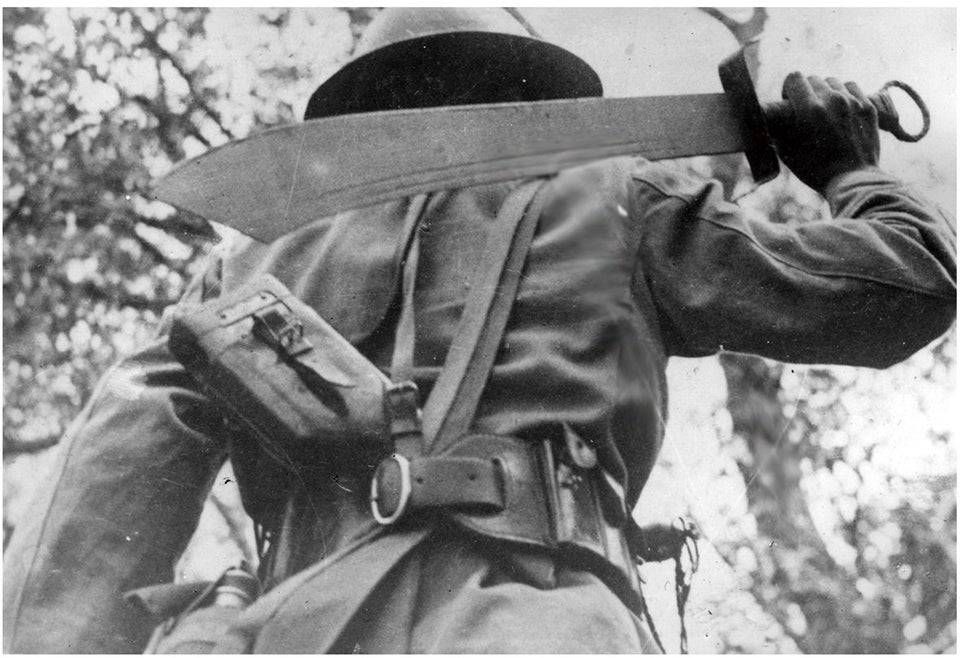 A_soldier_from_the_KMT_s_29th_Army_Group_wearing_a_Brodie_helm_and_with_...